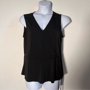 NWT Black Faux Wrap top with decorative waist tie. Flattering v-neck wrap cut